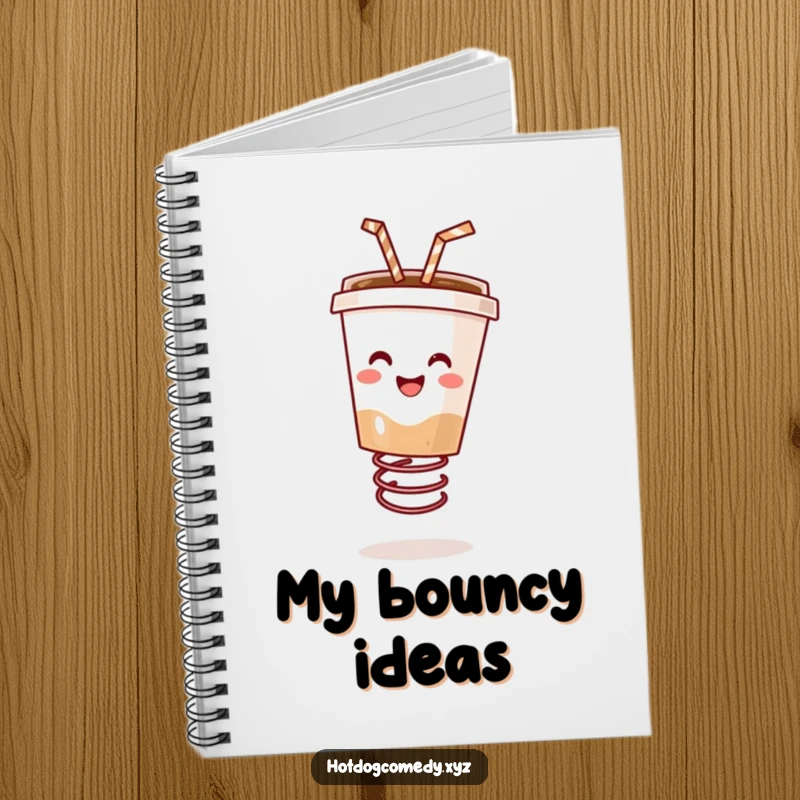 Funny happy coffee cup with a straw bouncing on a spring on a notebook cover, ready for writing, perfect for a funny gift.